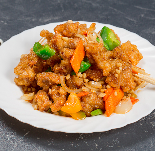136. Свинина в кляре с овощами и кедровым орехом
